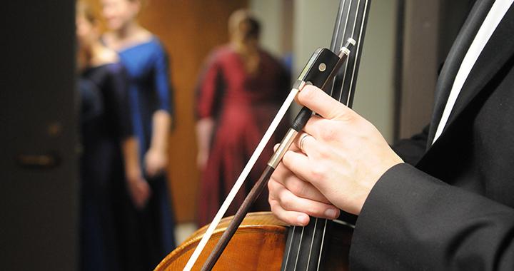 a musician holding an instrument